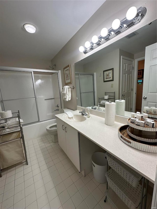5316 Pershing Ave Unit 507, Saint Louis, MO 63112 - full bath featuring tile patterned flooring, toilet, combined bath / shower with glass door, and vanity