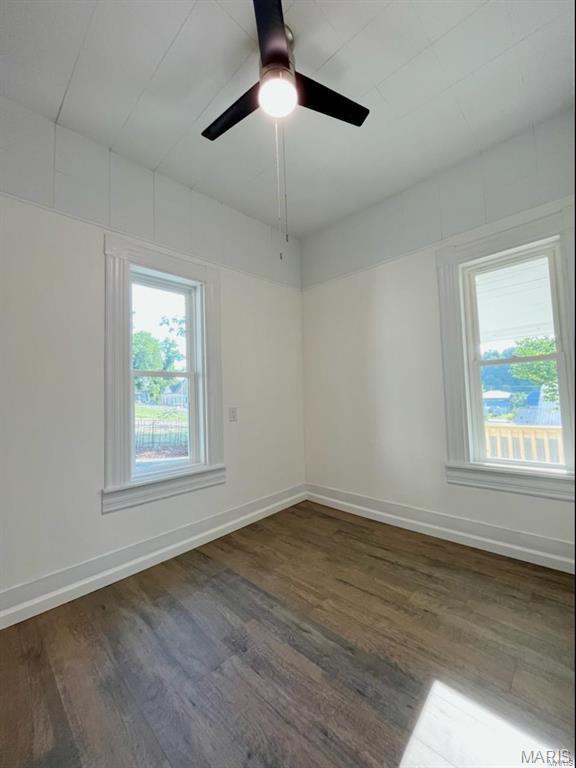 360 3rd St, Ellington, MO 63638 - unfurnished room featuring wood finished floors, baseboards, and ceiling fan