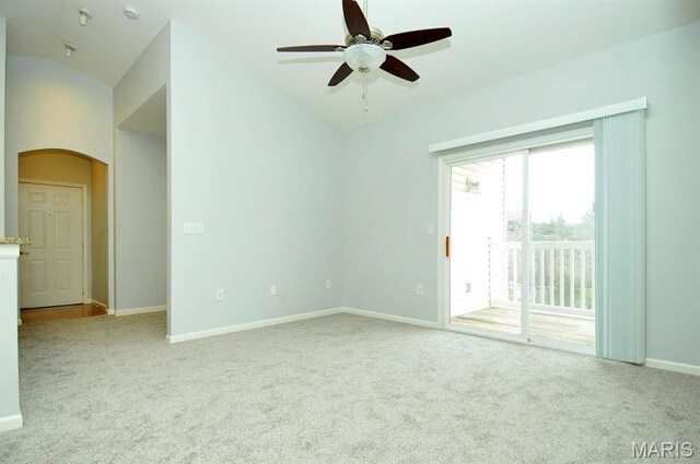 39 Kassebaum Ln Unit 303, Saint Louis, MO 63129 - carpeted empty room with lofted ceiling, arched walkways, a ceiling fan, and baseboards