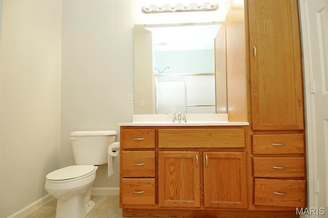 39 Kassebaum Ln Unit 303, Saint Louis, MO 63129 - full bathroom with toilet, baseboards, vanity, a shower with door, and tile patterned floors
