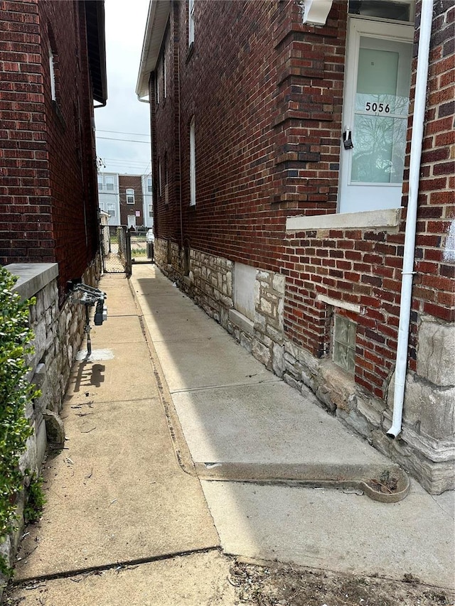 5056 Lindenwood Ave, Saint Louis, MO 63109 - view of property exterior featuring brick siding