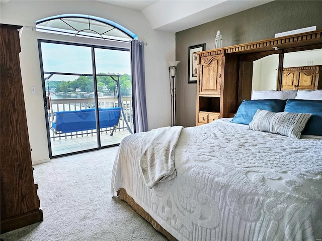 86 Aqua Fin Rd Unit 3B, Osage Beach, MO 65049 - bedroom featuring light carpet, access to outside, vaulted ceiling, a water view, and baseboards