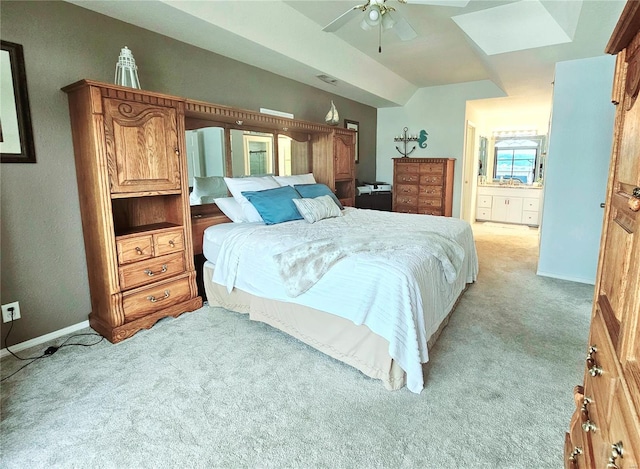 86 Aqua Fin Rd Unit 3B, Osage Beach, MO 65049 - bedroom with light carpet, baseboards, ensuite bath, lofted ceiling, and a ceiling fan