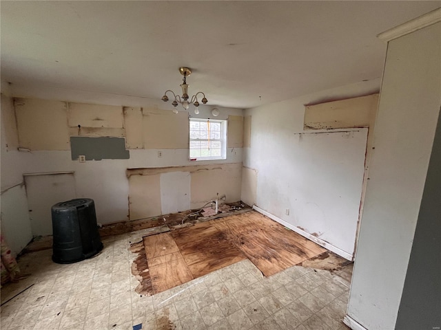 unfurnished dining area featuring light floors and a chandelier