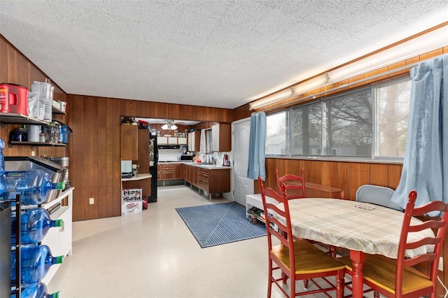 dining space with wooden walls