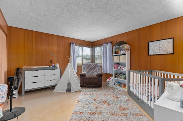 bedroom with wood walls
