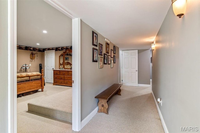 hall featuring carpet, baseboards, and recessed lighting