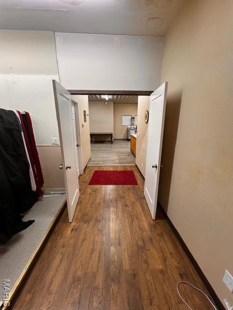 corridor featuring wood finished floors