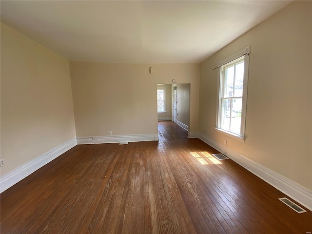1309 Belton Ave, Webster Groves, MO 63119 - spare room featuring dark wood-type flooring and baseboards