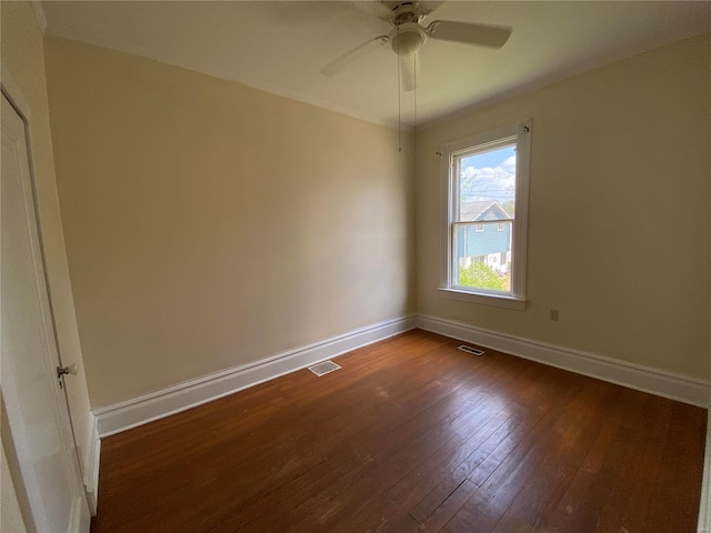 1309 Belton Ave, Webster Groves, MO 63119 - empty room featuring baseboards, dark wood finished floors, and a ceiling fan