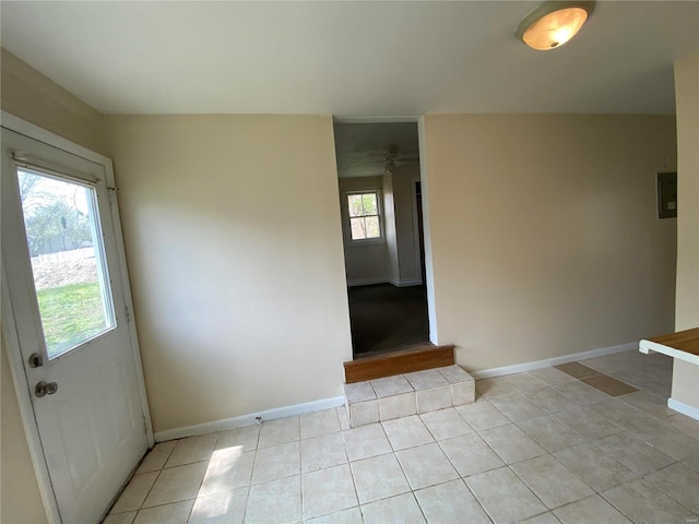 1309 Belton Ave, Webster Groves, MO 63119 - unfurnished room with baseboards, light tile patterned flooring, and a ceiling fan