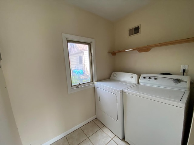 1309 Belton Ave, Webster Groves, MO 63119 - clothes washing area with separate washer and dryer, light tile patterned floors, and baseboards