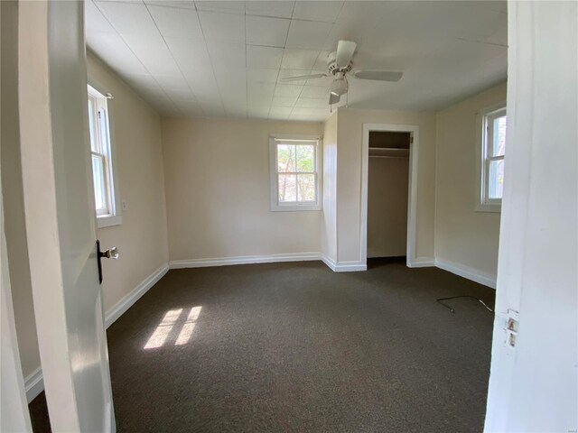 1309 Belton Ave, Webster Groves, MO 63119 - unfurnished bedroom featuring dark carpet, a closet, baseboards, and ceiling fan