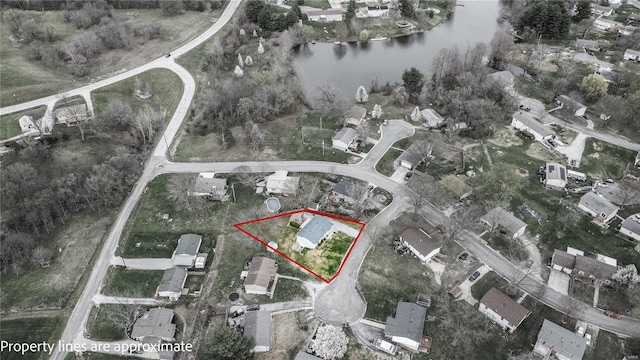 aerial overview of property's location featuring a nearby body of water and property parcel outlined
