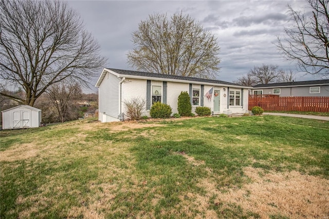 ranch-style home with a shed, an outbuilding, and brick siding