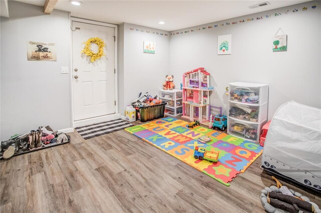playroom with wood finished floors, recessed lighting, and baseboards