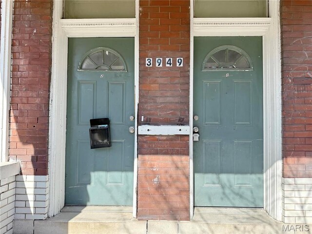3949 Palm St, Saint Louis, MO 63107 - view of exterior entry with brick siding