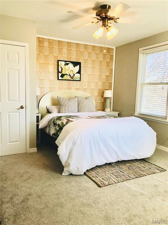 3579 Boswell, St John, MO 63114 - bedroom with carpet floors, ceiling fan, and baseboards