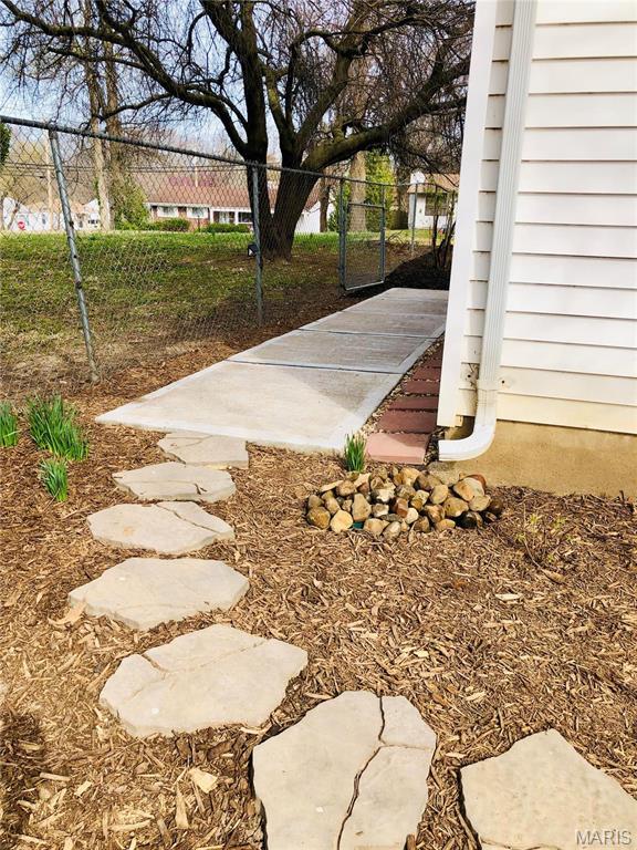 3579 Boswell, St John, MO 63114 - view of yard featuring a gate