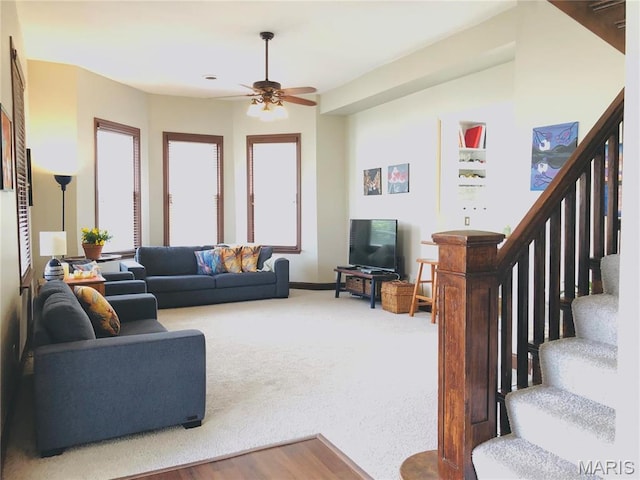 3579 Boswell, St John, MO 63114 - carpeted living room with a ceiling fan, stairs, and baseboards