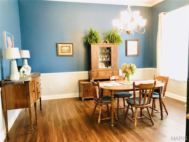 3579 Boswell, St John, MO 63114 - dining area featuring a chandelier, wood finished floors, baseboards, and ornamental molding