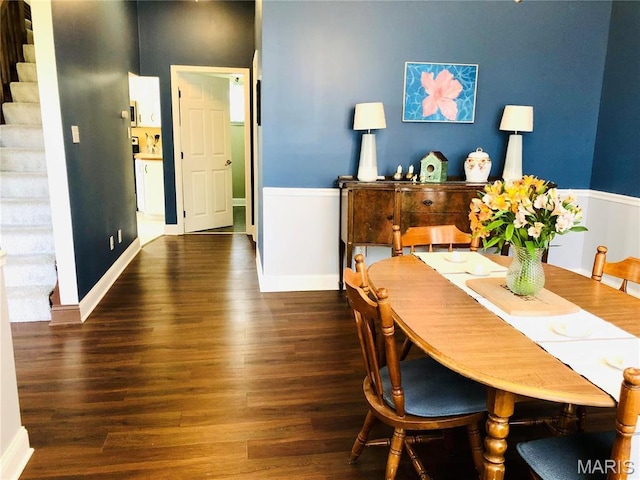 3579 Boswell, St John, MO 63114 - dining space with stairway, wood finished floors, and baseboards