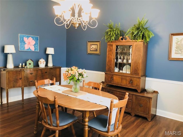 3579 Boswell, St John, MO 63114 - dining area featuring dark wood finished floors, a chandelier, and baseboards