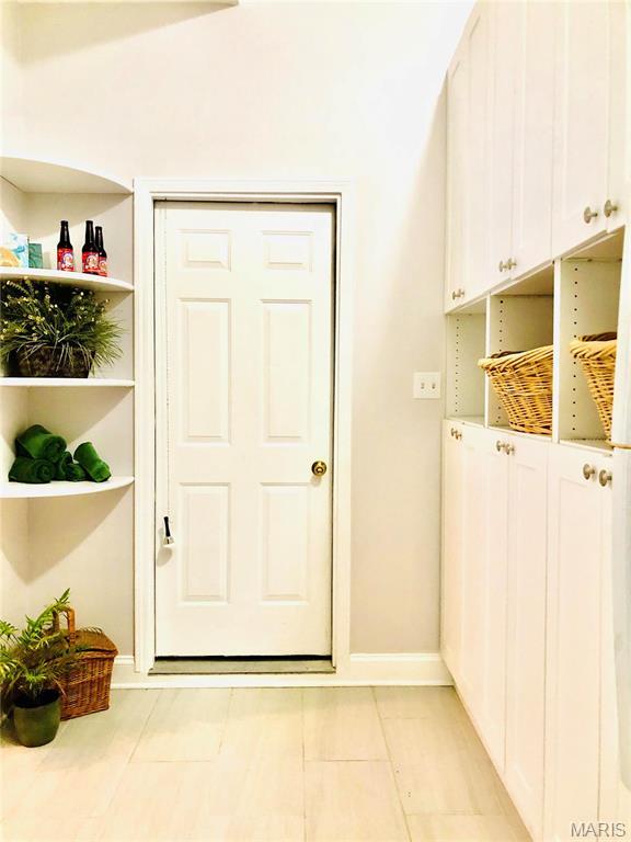 3579 Boswell, St John, MO 63114 - mudroom featuring baseboards and light tile patterned floors