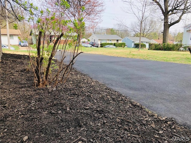 3579 Boswell, St John, MO 63114 - view of asphalt driveway with a residential view