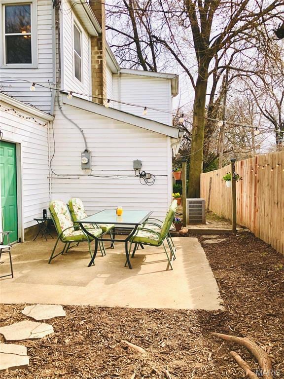 3579 Boswell, St John, MO 63114 - view of patio with central AC unit and outdoor dining area