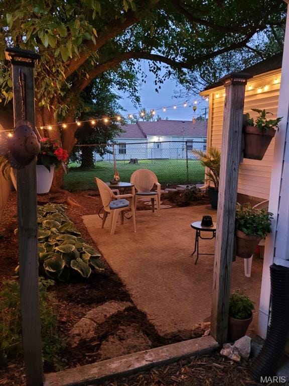 3579 Boswell, St John, MO 63114 - patio terrace at dusk with a patio area