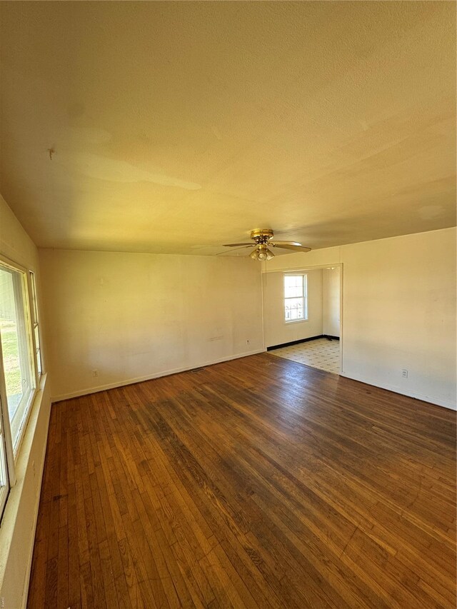 445 Manion, Sullivan, MO 63080 - empty room featuring hardwood / wood-style flooring, a ceiling fan, and a textured ceiling