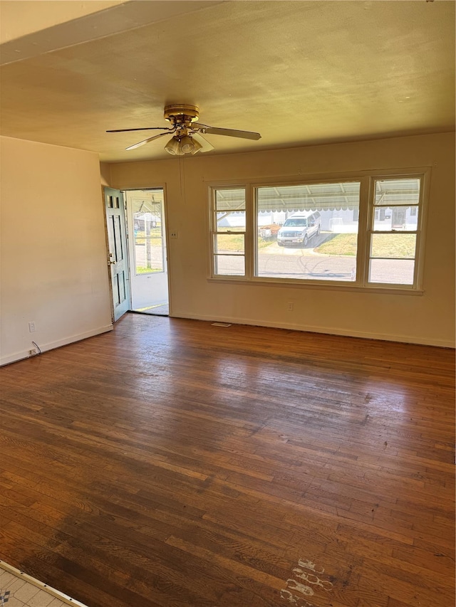 445 Manion, Sullivan, MO 63080 - spare room featuring dark wood-style flooring, baseboards, and ceiling fan