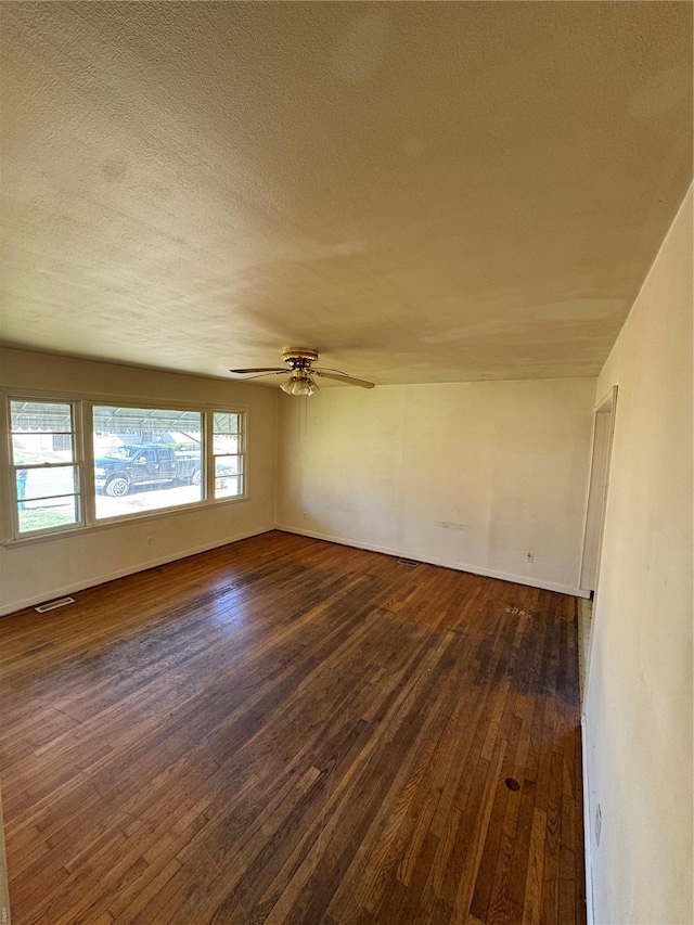 445 Manion, Sullivan, MO 63080 - unfurnished room with dark wood finished floors, ceiling fan, a textured ceiling, and baseboards