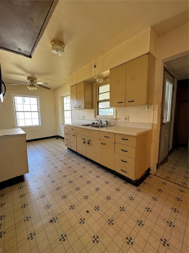 445 Manion, Sullivan, MO 63080 - kitchen featuring a sink, light countertops, healthy amount of natural light, and ceiling fan