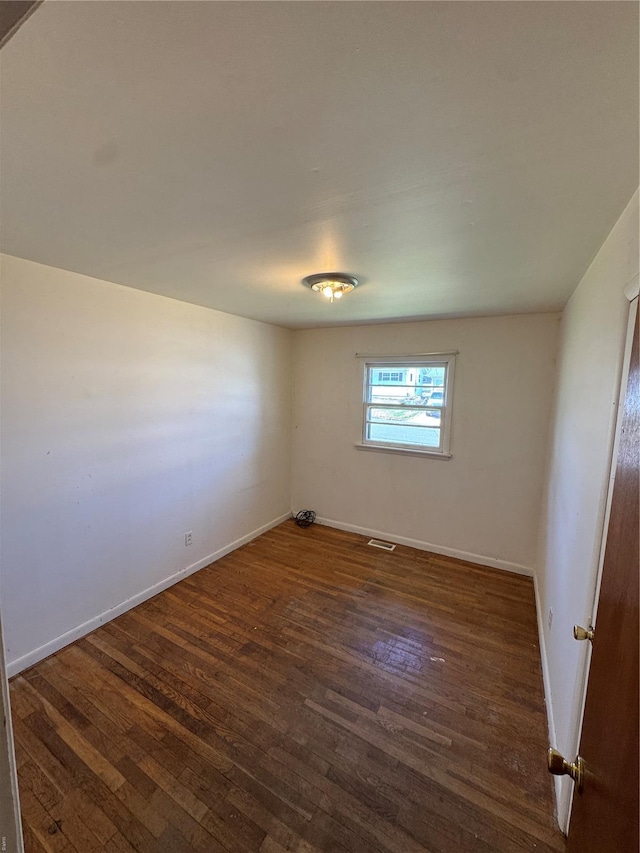 445 Manion, Sullivan, MO 63080 - unfurnished room with dark wood finished floors and baseboards