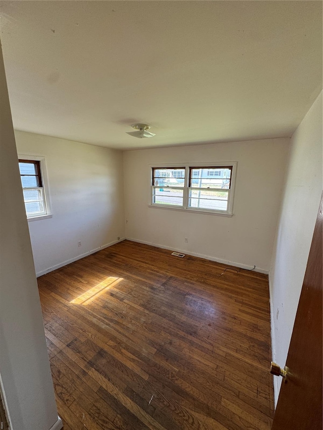 445 Manion, Sullivan, MO 63080 - spare room featuring dark wood-type flooring and baseboards