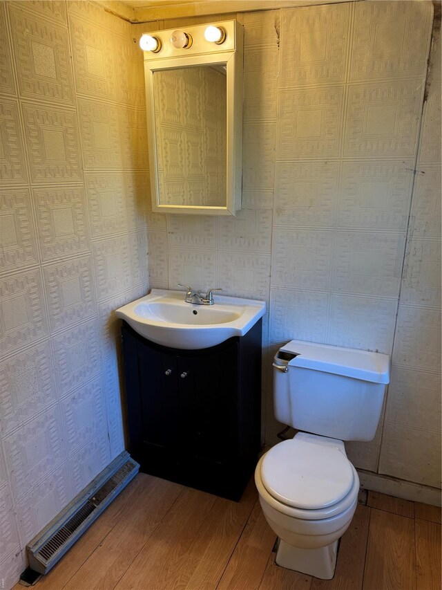 445 Manion, Sullivan, MO 63080 - bathroom featuring wood finished floors, toilet, and vanity