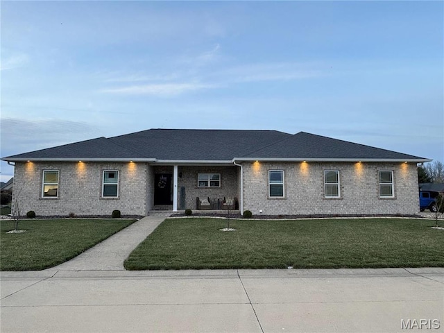 1143 Dave Kay St, Breese, IL 62230 - view of front of house featuring a front lawn, brick siding, a porch, and a shingled roof