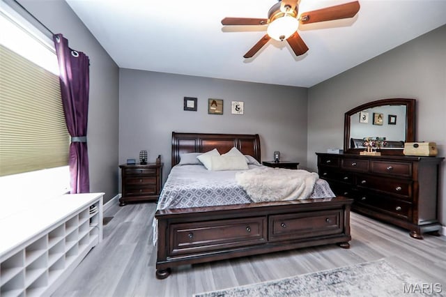 1143 Dave Kay St, Breese, IL 62230 - bedroom with light wood-type flooring, ceiling fan, and baseboards