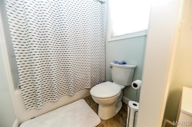 1143 Dave Kay St, Breese, IL 62230 - full bathroom with tile patterned floors, toilet, shower / bath combo with shower curtain, and baseboards
