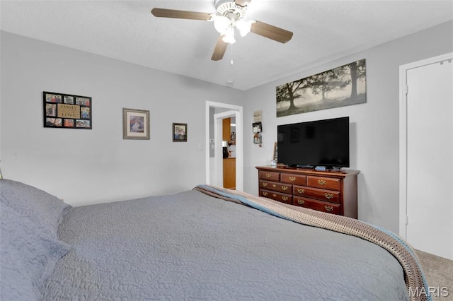 carpeted bedroom featuring a ceiling fan