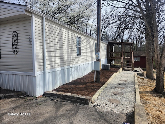 209 Sentry Oaks, Union, MO 63084 - view of property exterior with central air condition unit, stairway, and a deck