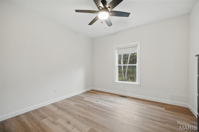 19011 Pinckney Manor Ct, Warrenton, MO 63383 - empty room with light wood-style flooring, baseboards, and ceiling fan