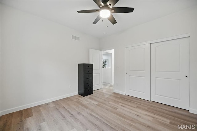 19011 Pinckney Manor Ct, Warrenton, MO 63383 - unfurnished bedroom with light wood-style floors, baseboards, a closet, and a ceiling fan