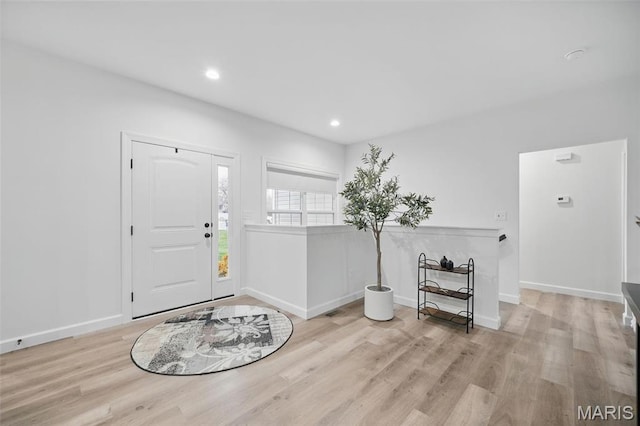 19011 Pinckney Manor Ct, Warrenton, MO 63383 - foyer with wood finished floors, baseboards, and recessed lighting