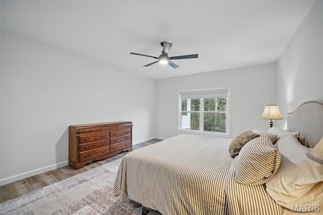 19011 Pinckney Manor Ct, Warrenton, MO 63383 - bedroom featuring baseboards, wood finished floors, and a ceiling fan