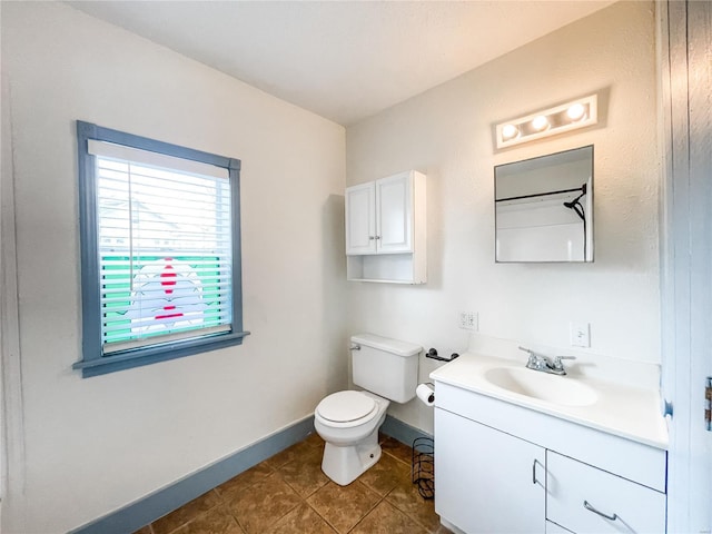 791 E Adams St, Nashville, IL 62263 - bathroom with toilet, vanity, baseboards, and tile patterned flooring