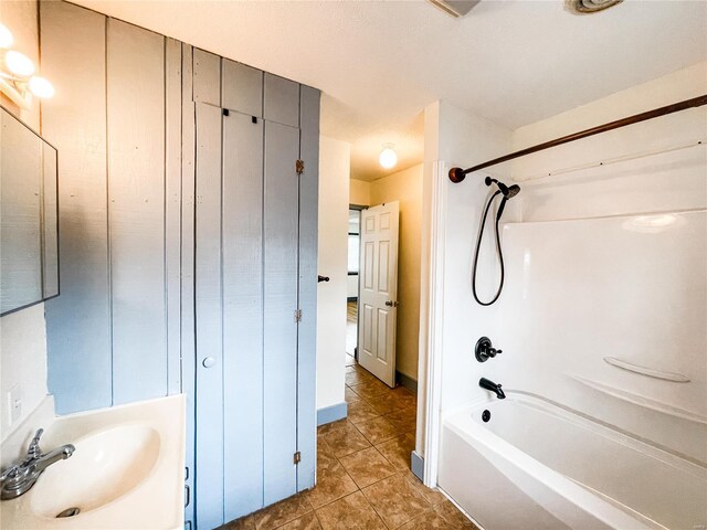791 E Adams St, Nashville, IL 62263 - full bathroom featuring a sink, tile patterned flooring, and shower / tub combination