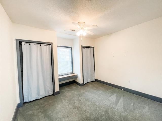 791 E Adams St, Nashville, IL 62263 - unfurnished bedroom with carpet flooring, baseboards, ceiling fan, and a textured ceiling